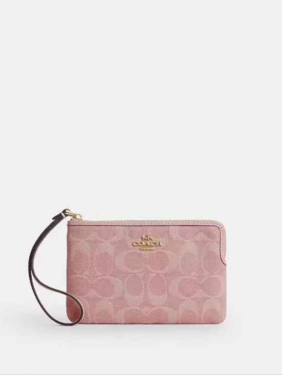 Coach Handbags - Coach Pink Denim Zip Around Wristlet with Gold Hardware